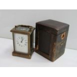 An early 20th Century French brass carriage clock with Roman enamelled (hairlined),