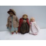 Three small early clothed dolls including two wax examples