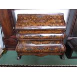 An 18th Century Dutch marquetry bombé-shaped bureau with ball and claw front legs (various damage)