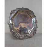 A William Comyns and Sons Victorian silver octagonal form salver with shell and foliate detail,