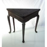 Circa 1840 a heavily carved oak envelope corner table the hinged top over cabriole legs