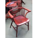 Circa 1800 an elm comb back Windsor elbow chair attributed to the Thames Valley region the dished