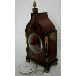 A Regency mahogany bracket clock case with pagoda top, decorative brass inlay, ormulu acorn finial,
