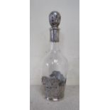 A William Moering glass decanter of small proportions with silver cased banding depicting figures