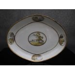 A Derby dessert dish with central landscape and four smaller vignettes around the rim,