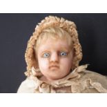 A 25" wax doll in long dress, missing foot,