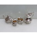 A silver four piece tea service by Fenton, Russell and Co, Sheffield 1905, comprising water jug,