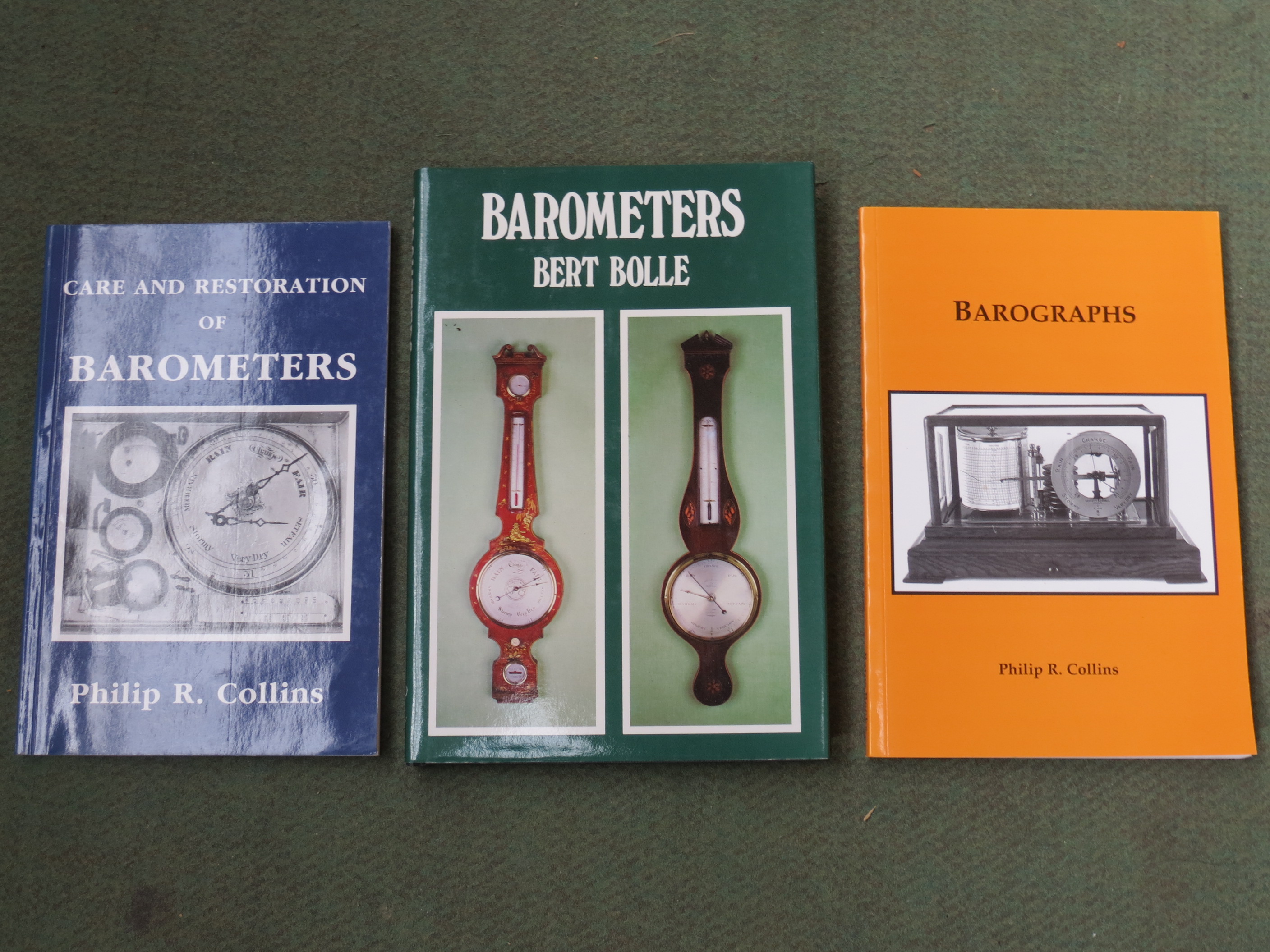 A hardback volume by Bert Bolle "Barometers" (1984), and two by Philip R.