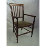 An Edwardian line inlaid mahogany child's elbow chair