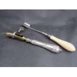 An ivory handled stilton scoop and a ham bone holder (2)