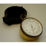 A 2.5" brass cased pocket aneroid barometer with altitude ring, maker Gallaghan & Co.