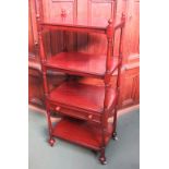 Circa 1860 a flamed mahogany four tier whatnot,