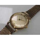 OMEGA: An 18ct gold automatic gent's wristwatch with two tone dial, gilt hands and markers,