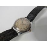 A steel cased gent's wristwatch with silvered Arabic dial (pitted), glass cracked, circa 1940's,