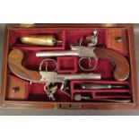 A pair of late 18th/early 19th Century flintlock boxlock dueling pistols with rosewood grips,