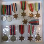 A collection of medals including WWII Pacific, Italy, Africa, Atlantic, Burma,