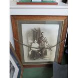 A WWI portrait photograph of a British Army serviceman, oak framed,