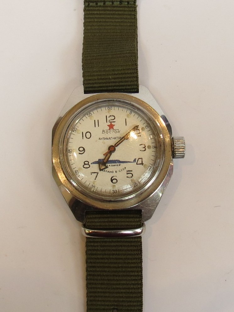 A mid 20th Century Russian automatic wristwatch with green canvas strap