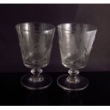 A pair of 19th Century rummer/toasting glasses etched with bride and groom and image of HMS Barabra