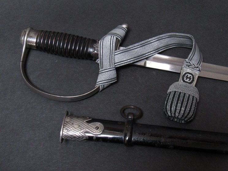 A Third Reich era German SS NCO sword by Hermann Rath,