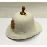 A Gibraltar regiment pith helmet with white canvas covering,