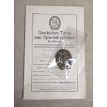 A pre WWII German DVL Sports Badge with award document and photograph