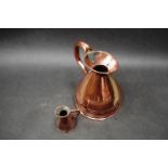 A Royal Navy 1/2 gallon copper rum jug and 1/4 gil rum jug (2)