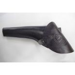 A reproduction Colt Navy black leather revolver holster,