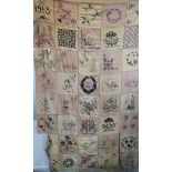 A WWI era hand embroidered bedspread with 1915,
