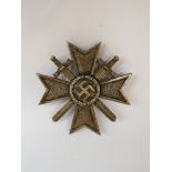 A German design War Merit Cross with swords First Class,