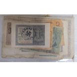 A collection of banknotes bearing Nazi occupation stamps,