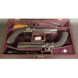 A pair of 19th Century Manton of London percussion dwelling pistols with octagonal faceted barrels,