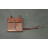 A leather pouch, possibly for ammunition clip and cleaning kit,