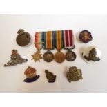 A quantity of military badges including "On War Service 1915" Ordnance,