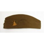A WWII British Army forage cap with Royal Norfolk Regt.