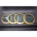 Four matching brass port holes,