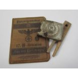 A German style 17th Panzer Division ID booklet with SS style belt buckle and peg (3)