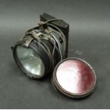 A WWII era Aldis lamp with three coloured glass lenses,