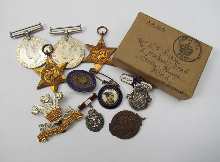 A quantity of WWII medals including 1939-45 star and silver brooches/badges