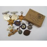 A quantity of WWII medals including 1939-45 star and silver brooches/badges