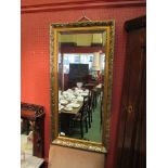 An oblong bevel edge mirror with acanthus leaf gilt frame,