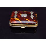 A 19th Century tortoiseshell purse with silver buckle and vacant cartouche,