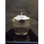 A Barker & Brothers Edwardian silver tea caddy in the Queen Anne style with fluted decoration,