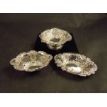Three silver pierced sweet meat/bonbon dishes, scrolling acanthus detail, various markers and dates,