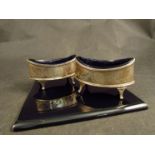 Possibly Alexander Field - A pair of silver boat shape salts with blue glass liner, engraved swags,