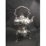 A plated spirit kettle on stand, embossed decoration,