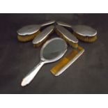 A silver backed six piece dressing table set,