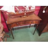 A Bevan Funnell George III style mahogany concave front writing desk the tooled leather insert