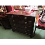 A George III flamed mahogany chest of four graduating long drawers on bracket feet