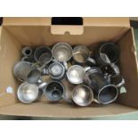 A quantity of pewter and plated tankards